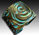 http://www.etsy.com/listing/98633595/old-gold-and-patina-polymer-clay-cuff?ref=usr_faveitems